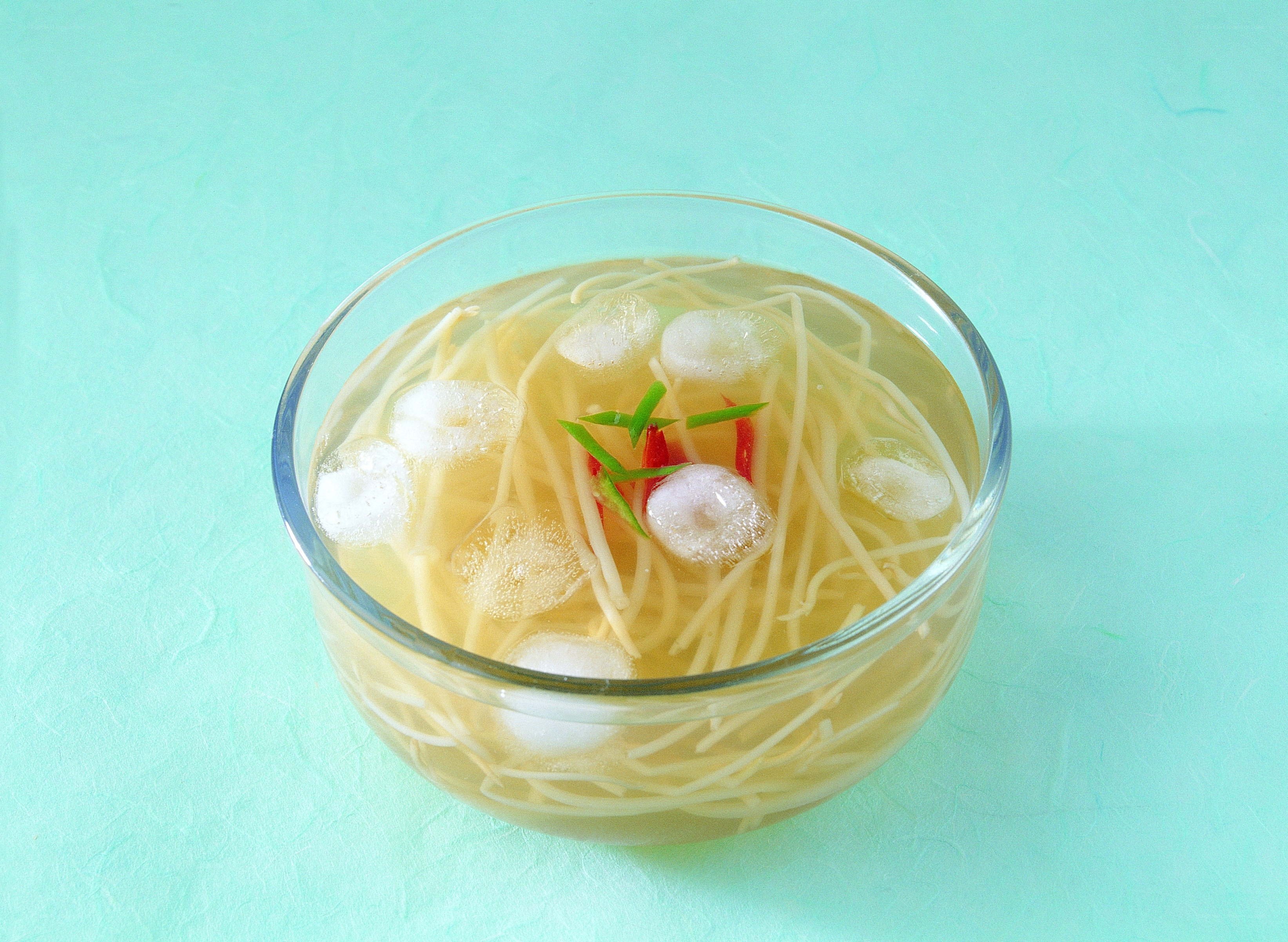 clear soup with noodles and garnish