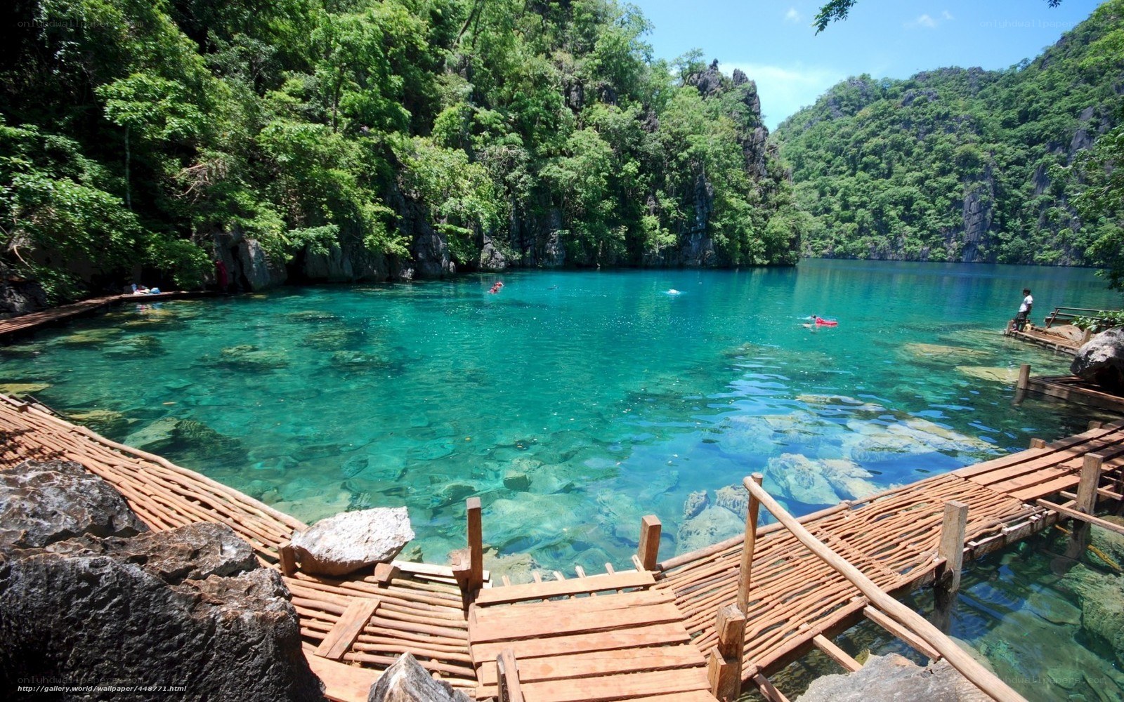 Clear turquoise lagoon with wooden walkway