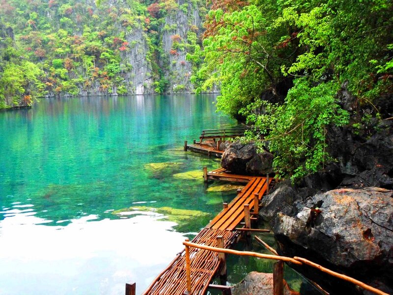 Clear turquoise lake with wooden dock