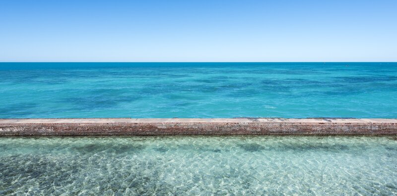 Clear Water and Brick Wall