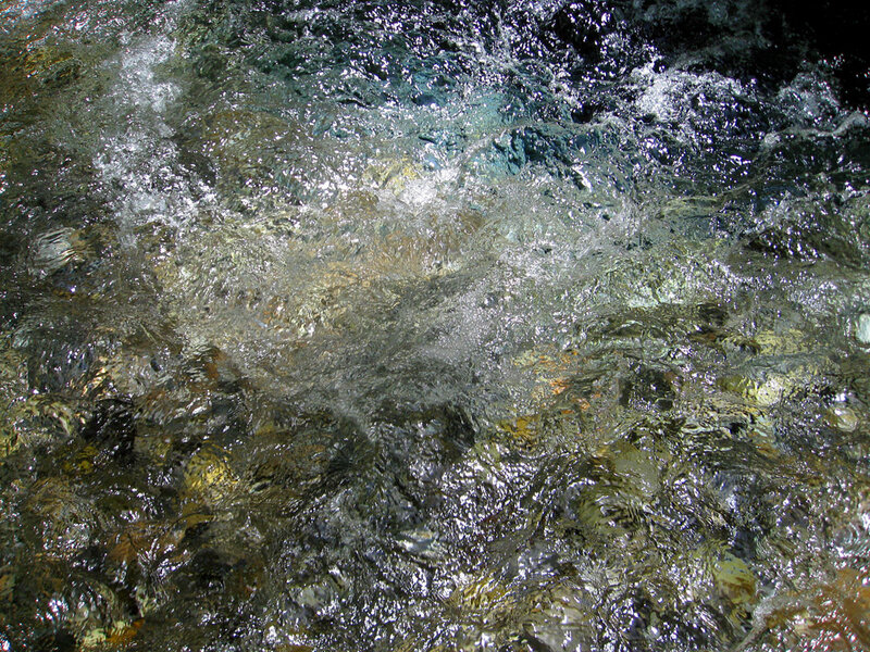 Clear Water Flowing over Rocks — Green