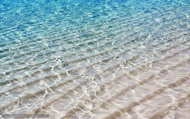 Clear water on sandy beach
