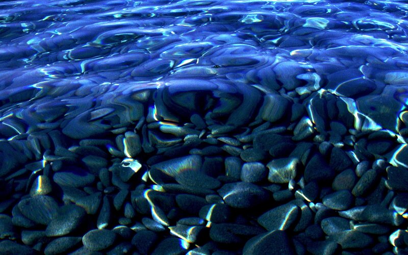 Clear water over pebbles