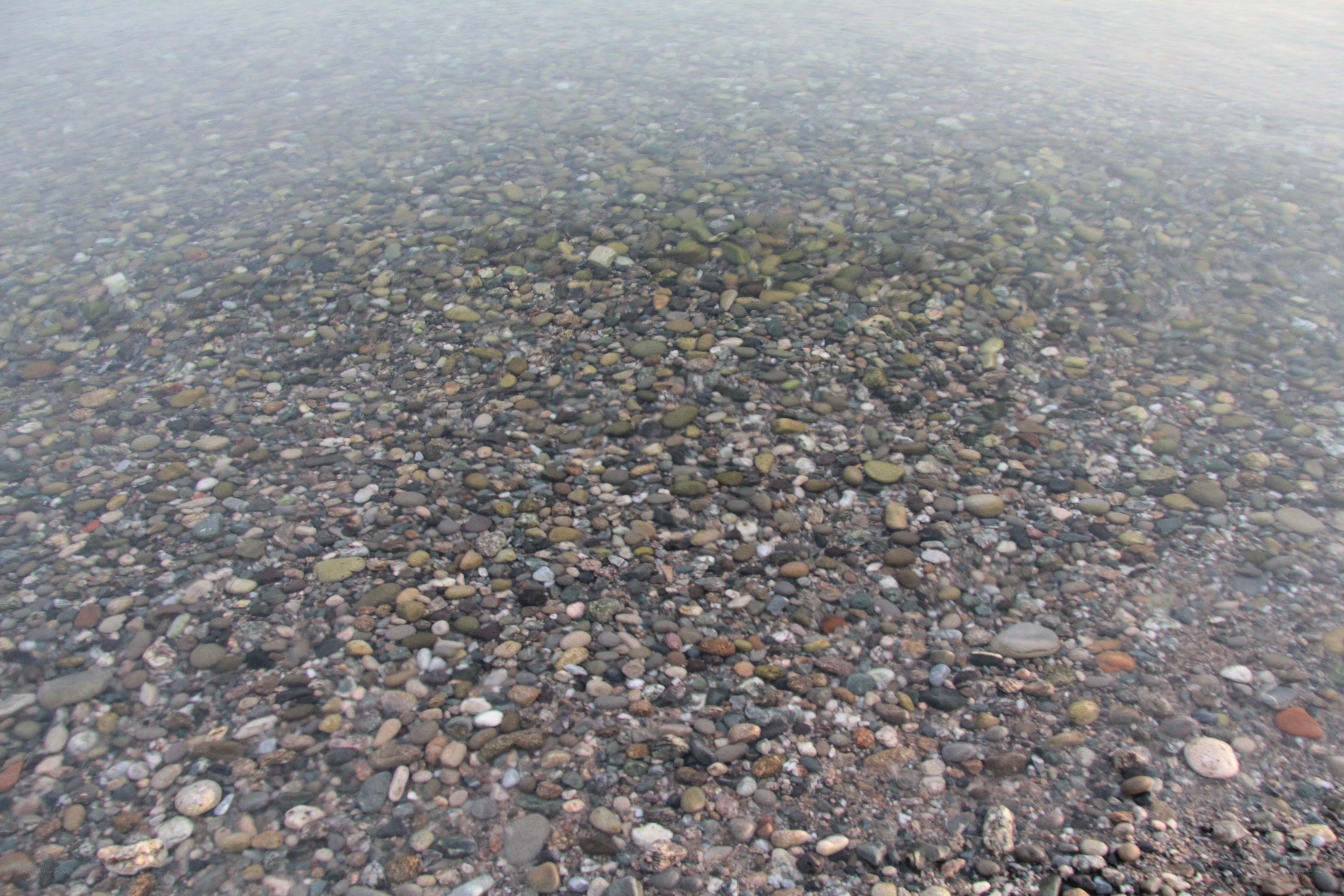 Clear water over pebbles
