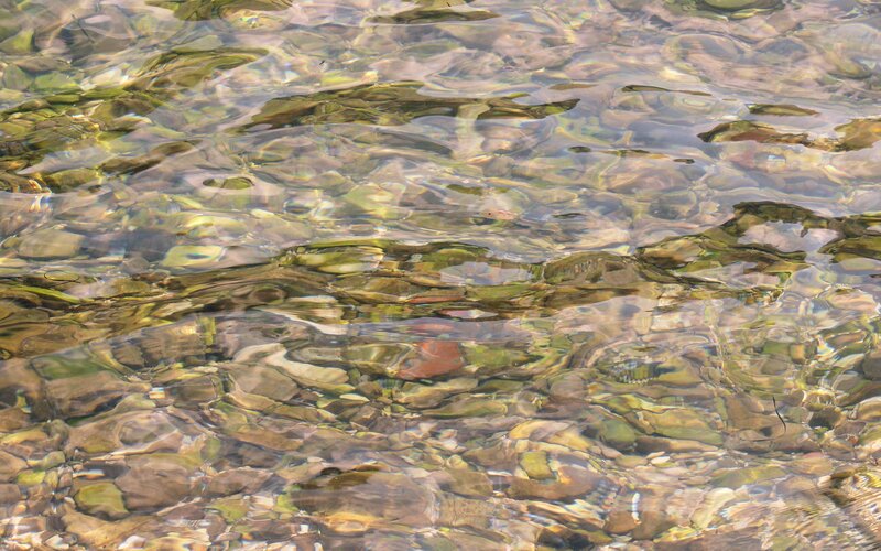 Clear water over pebbles