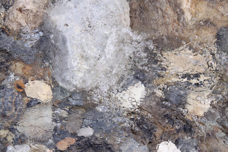 Clear Water over Rocks — Gray