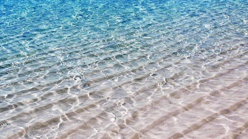 clear water over sandy beach