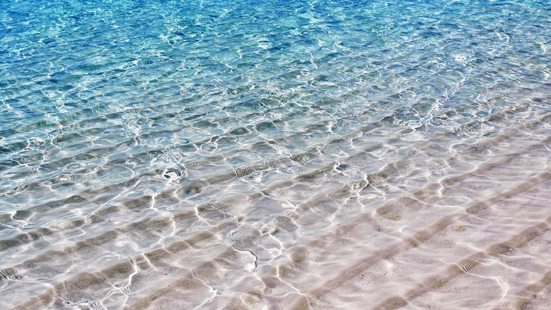 clear water over sandy beach