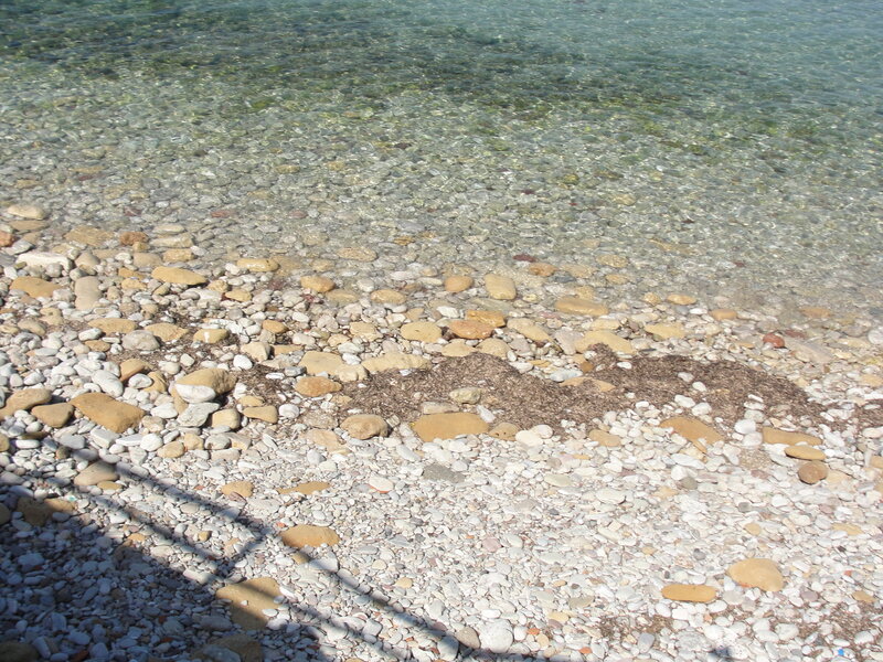 Clear water pebble beach