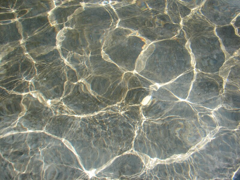 Clear water ripples on rocks