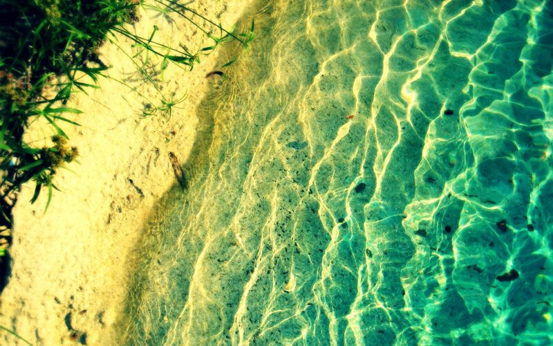 Clear water with sunlight patterns