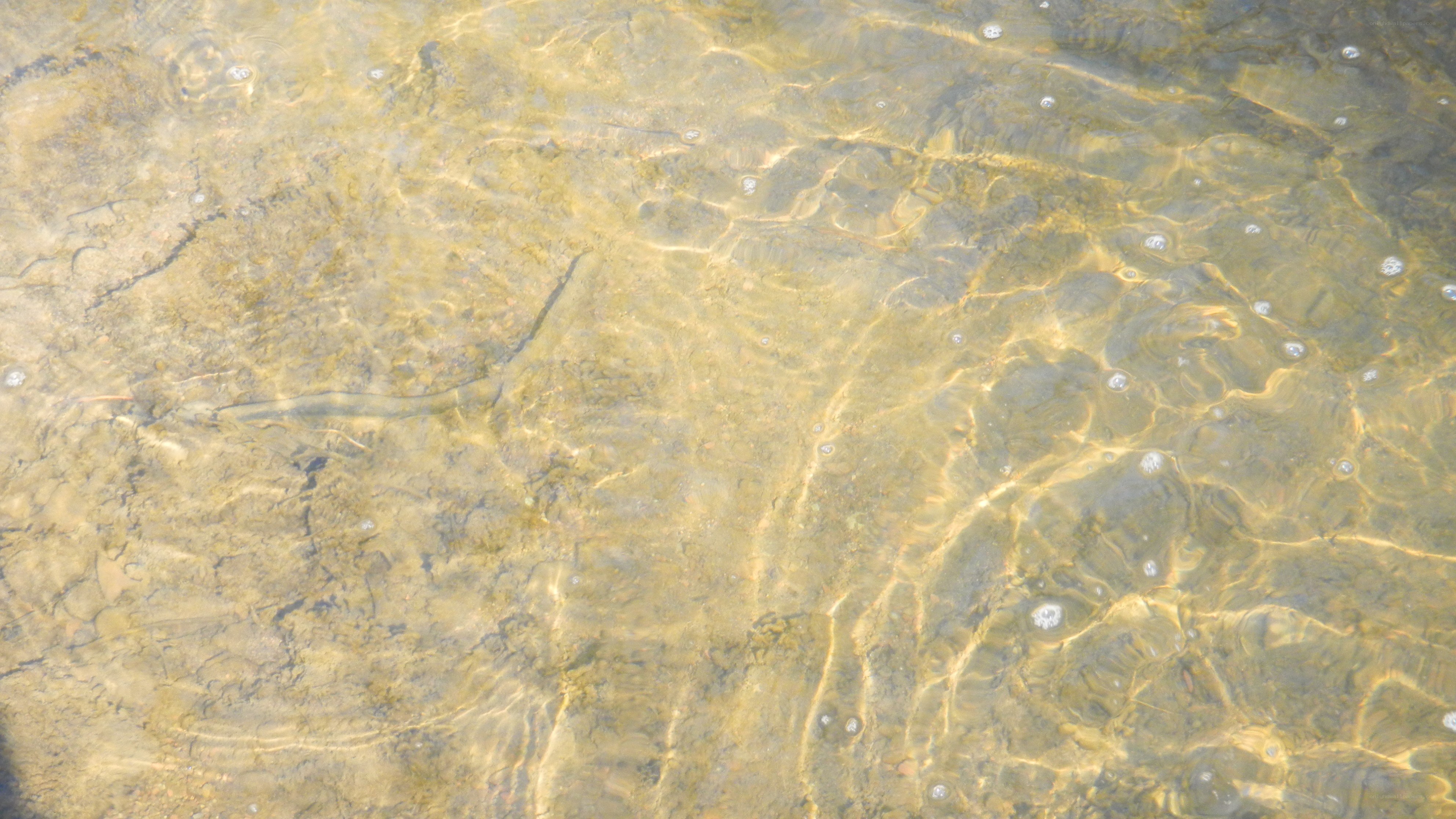 Clear water with underwater rocks
