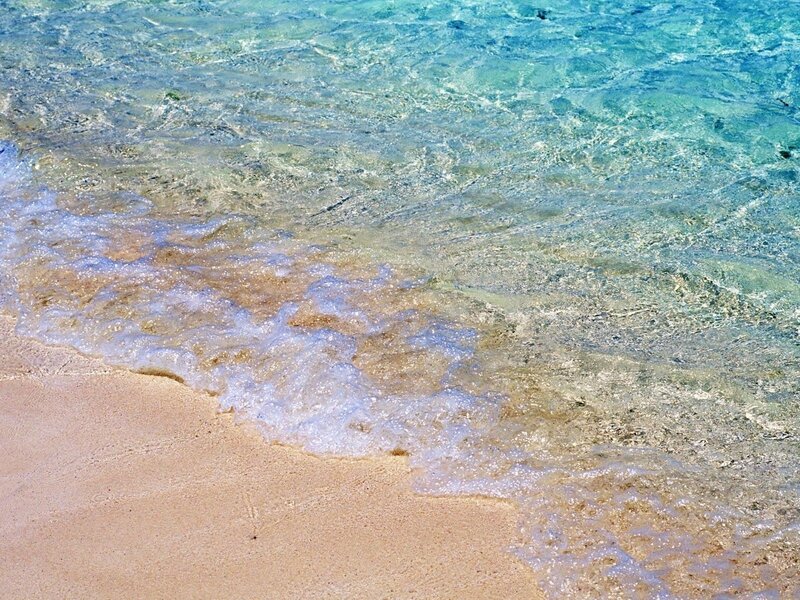 clear waves on sandy beach