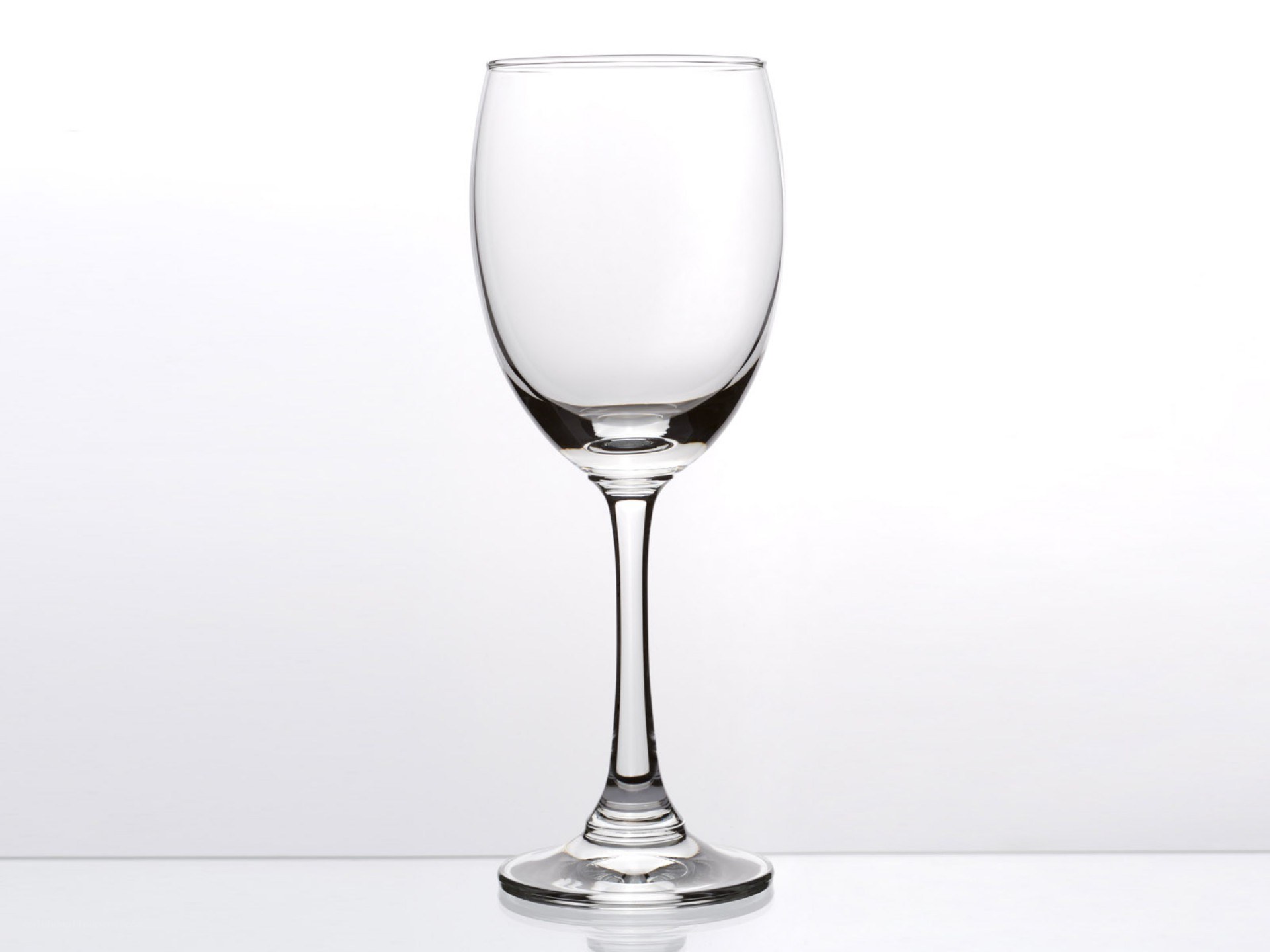 Clear wine glass on white