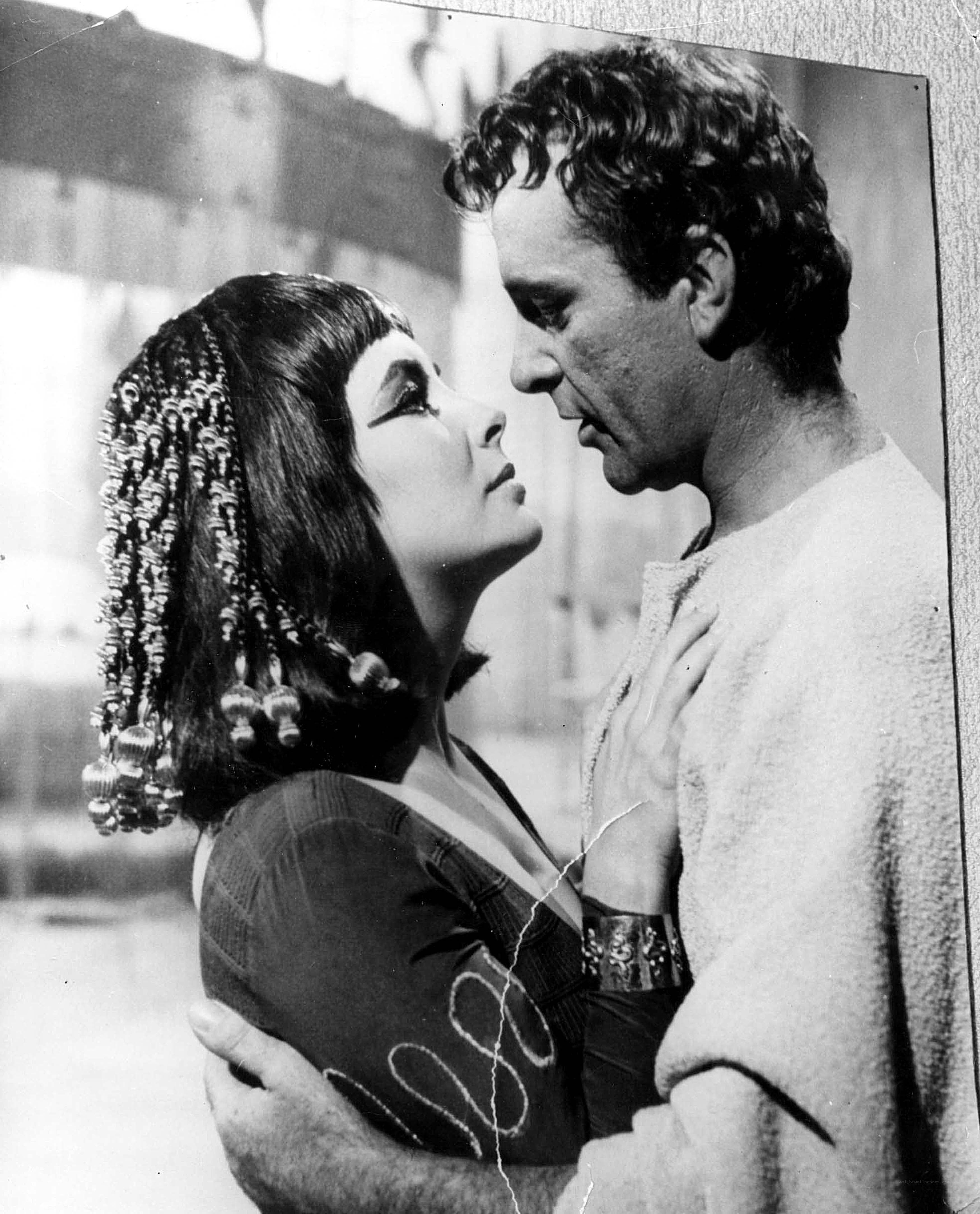 Cleopatra and Mark Antony embrace