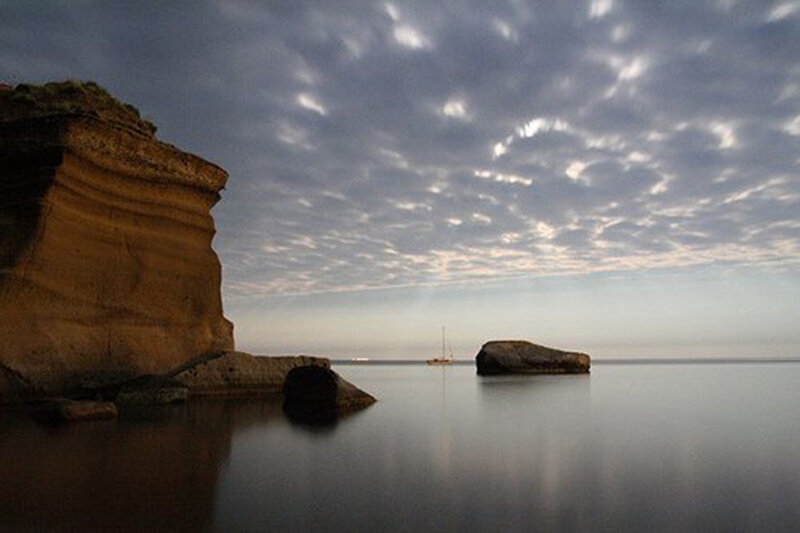 Cliff and Rocks at Sea