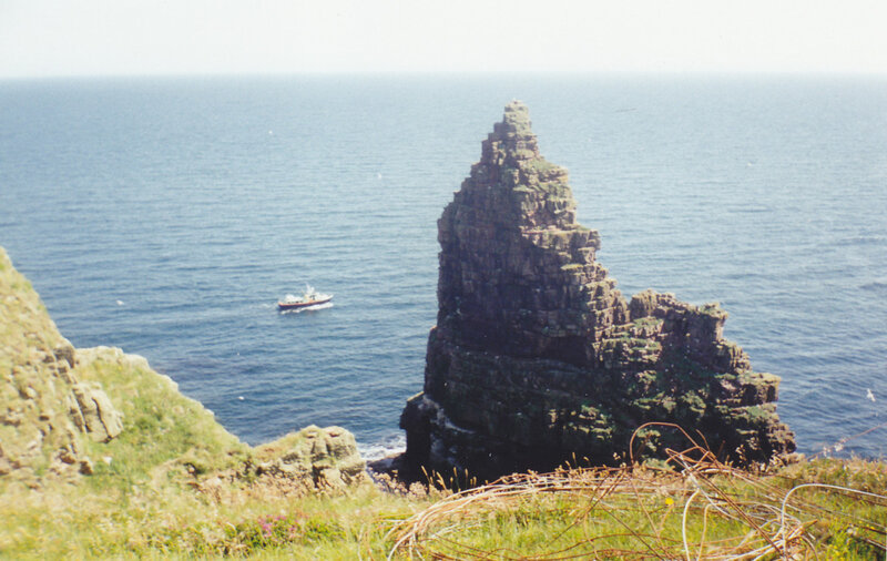 cliff and sea with boat