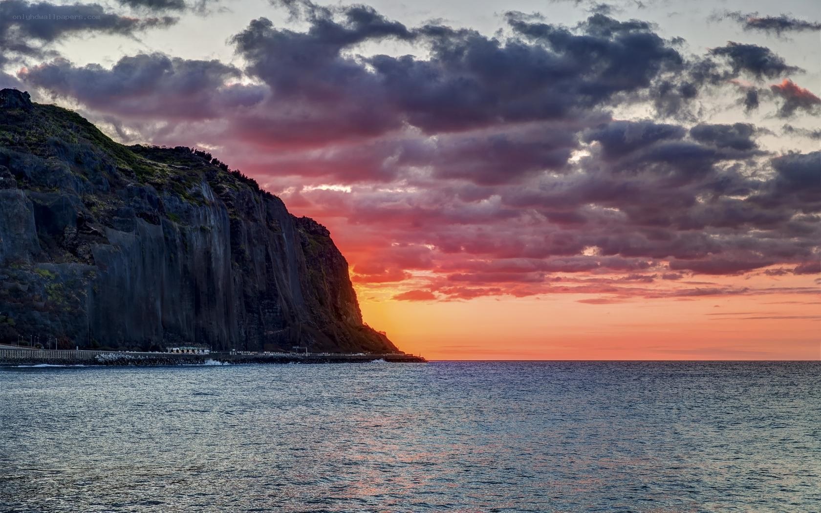 cliff at sunset over the sea