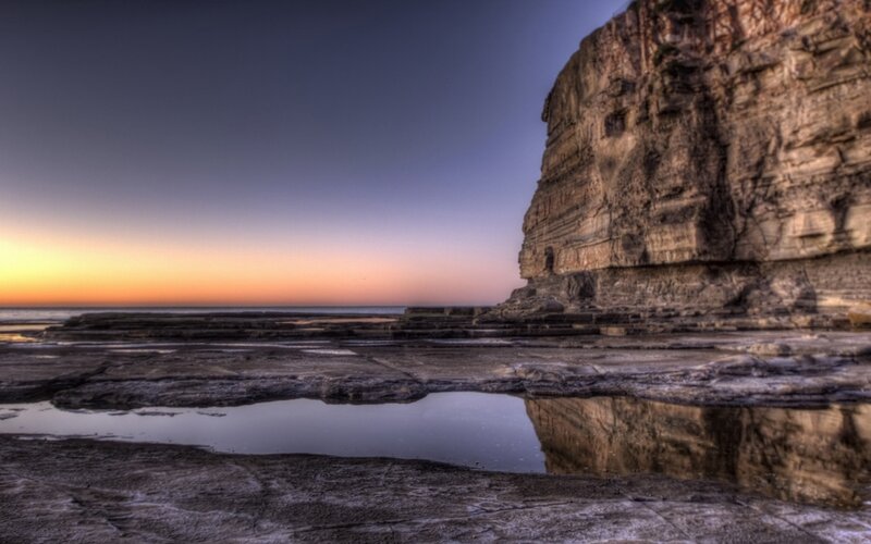 Cliff at sunset with tide pools