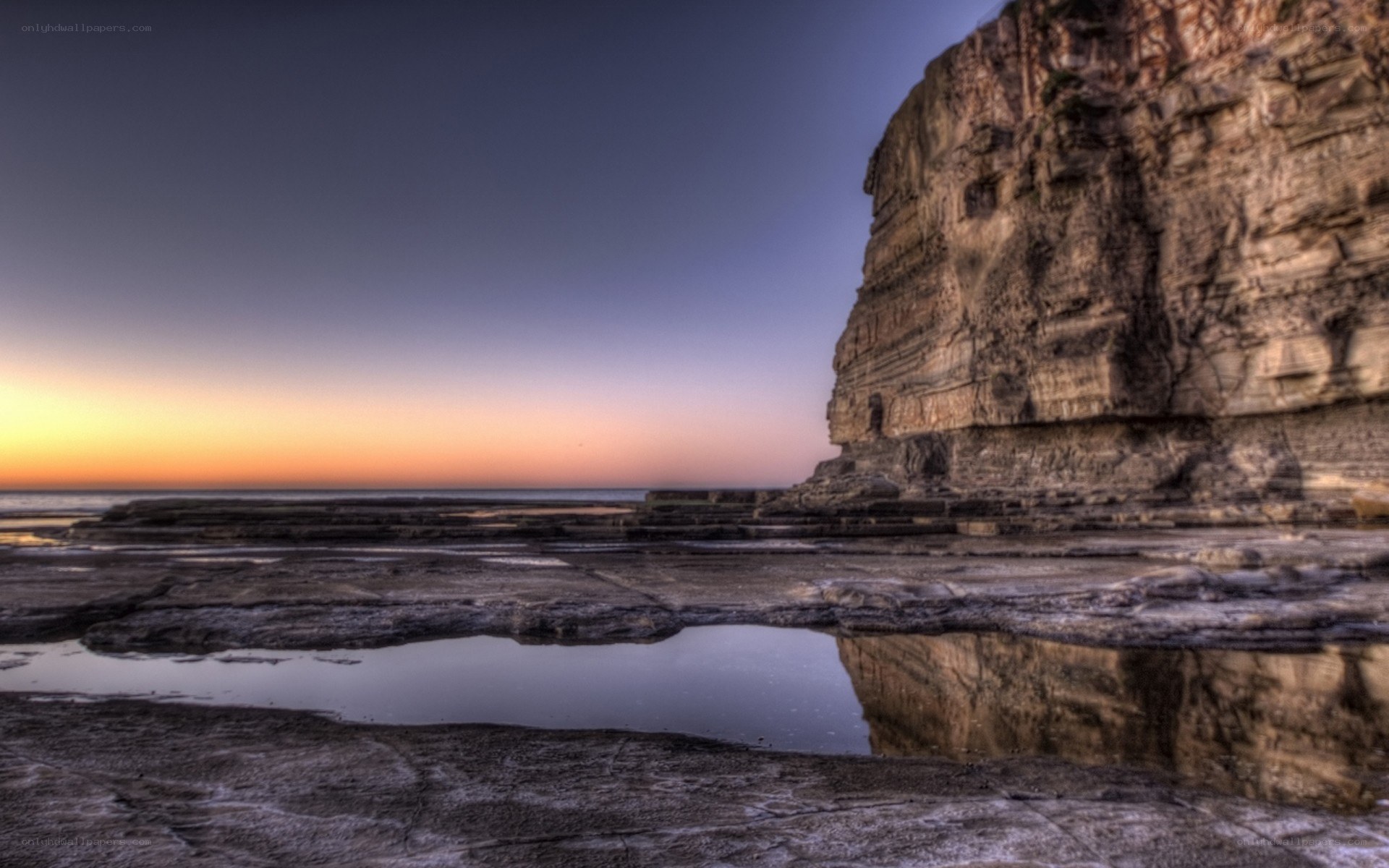 Cliff at sunset with tide pools
