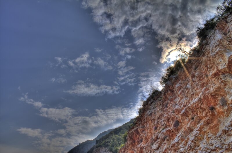 Cliff Face under Cloudy Sky