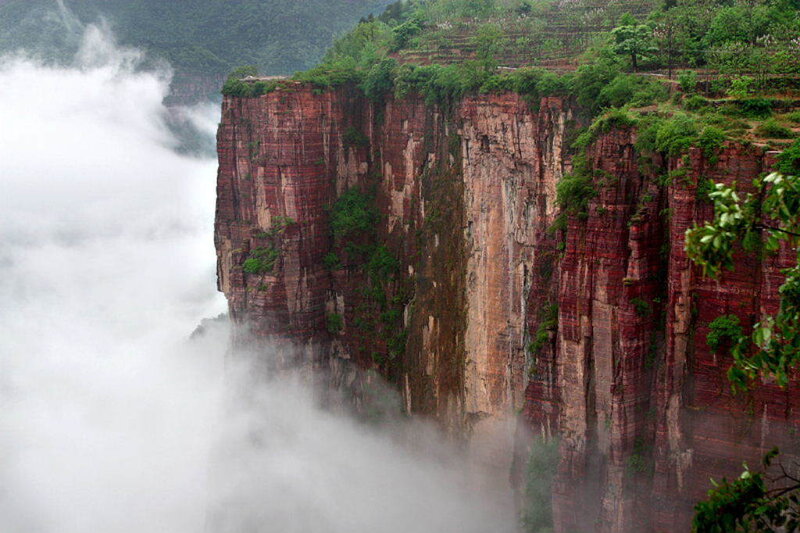 cliff face with clouds