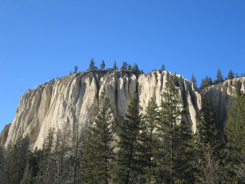 Cliff Face with Trees — Blue, Serene, Afternoon