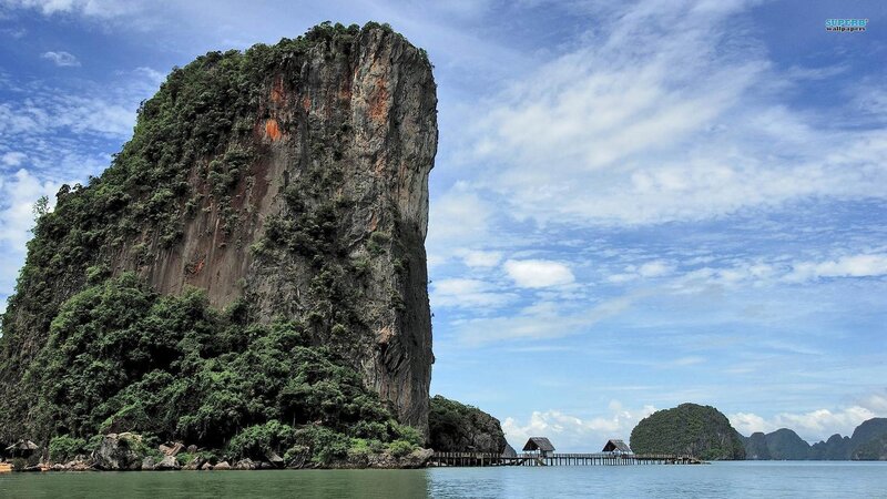 cliff island with wooden pier