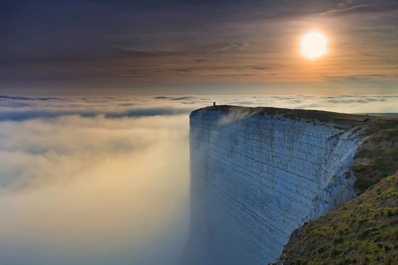 Cliff over sea of clouds