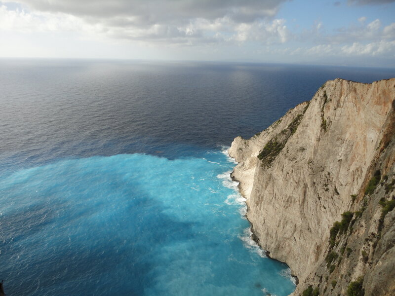 Cliff Overlooking Blue Sea — Dramatic