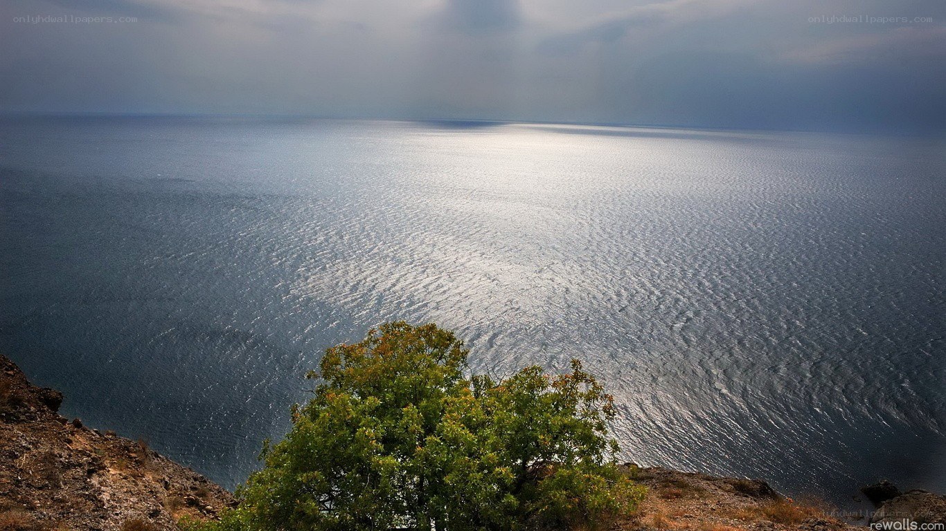 cliff overlooking calm sea