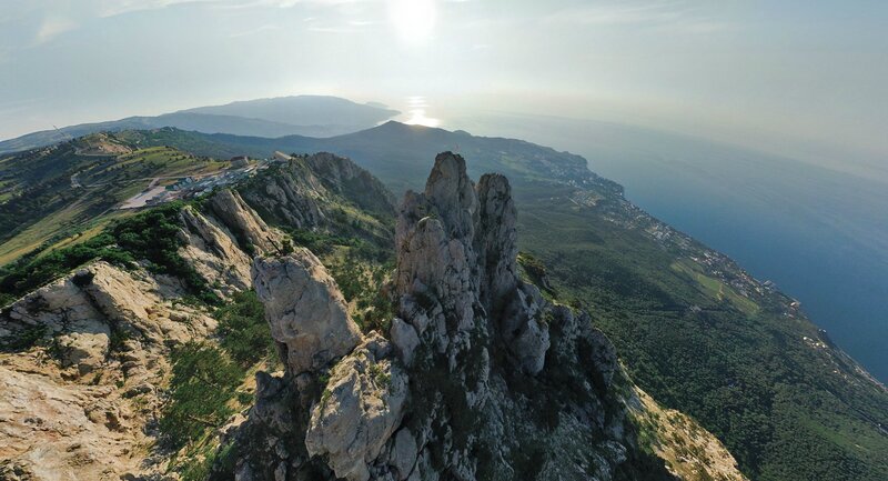 cliff overlooking coastal mountains