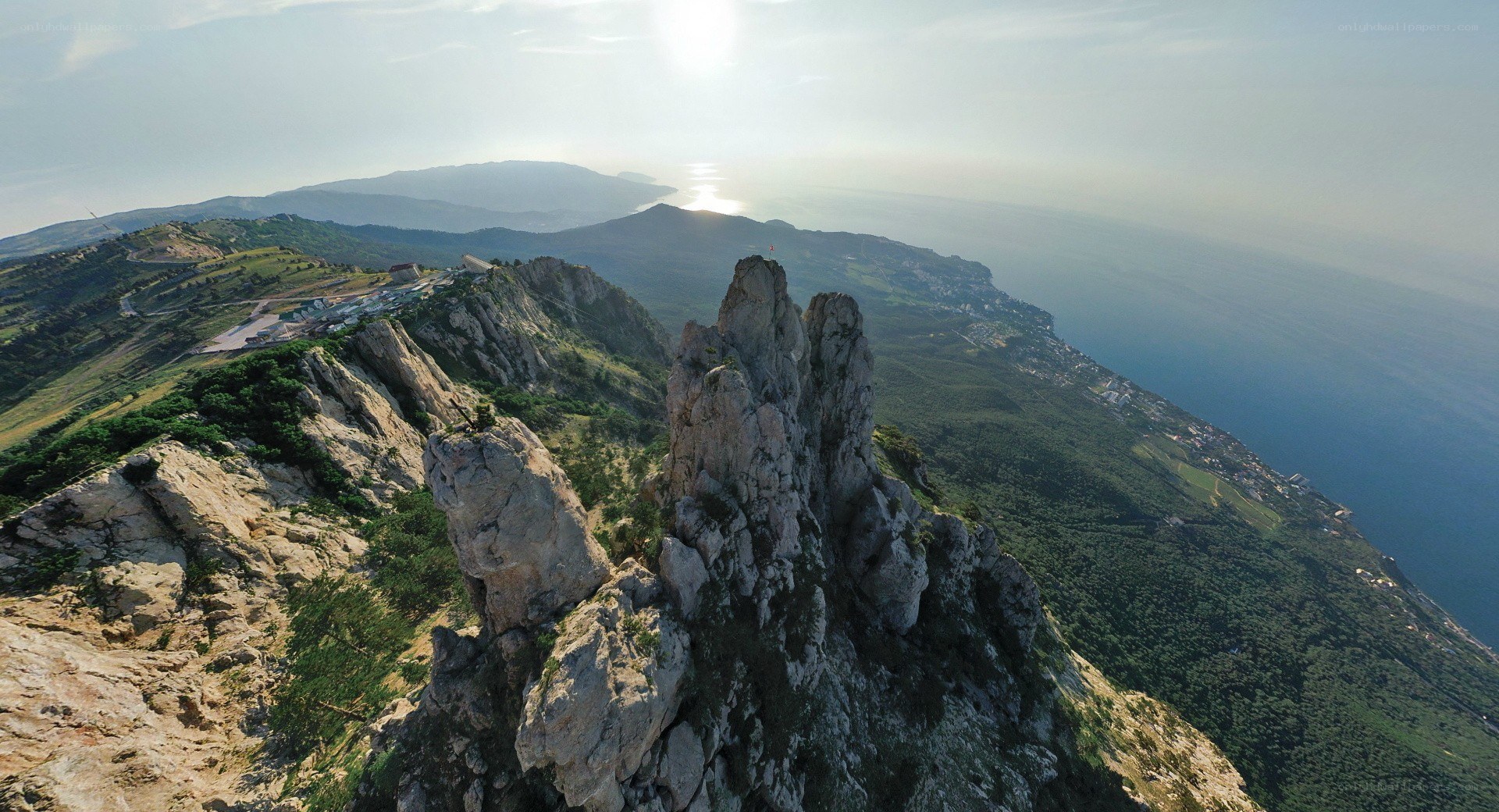 cliff overlooking coastal mountains