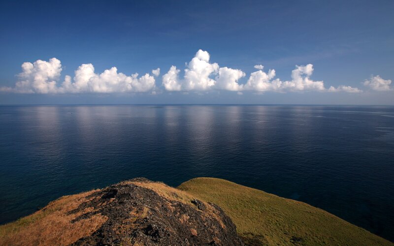Cliff Overlooking Ocean — Blue, Serene, Afternoon, Photograph, Clouds