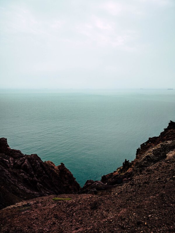 Cliff Overlooking Ocean — Blue, Serene, Photograph, Sky