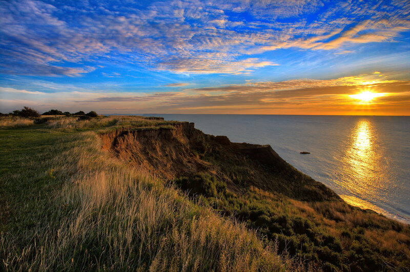 Cliff Overlooking Ocean — Blue, Serene, Sunset