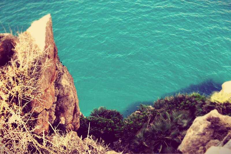 cliff overlooking turquoise sea