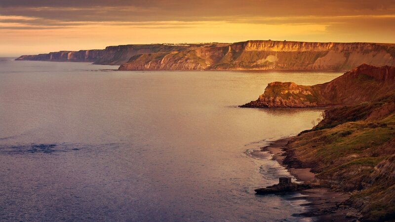 Cliffs Along Coastline — Orange