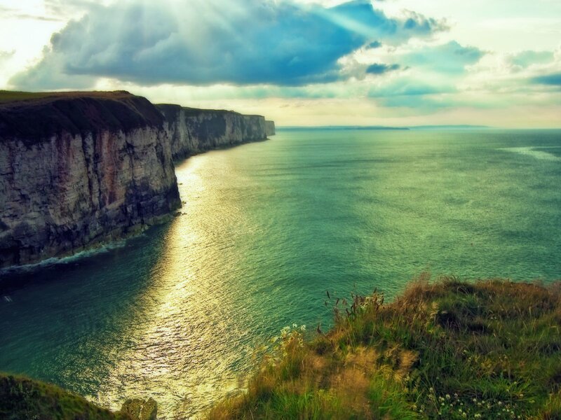 Cliffs Along Ocean Coast — Blue, Dramatic, Sunset, Photograph, Sky