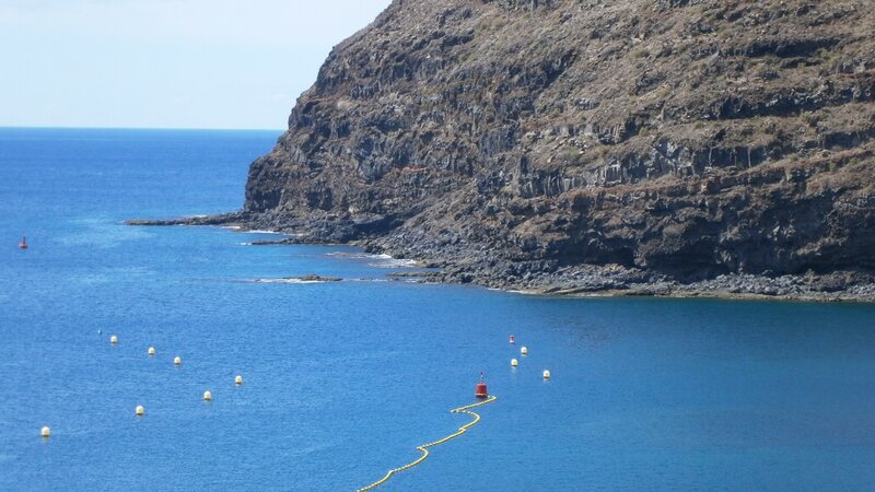 Cliffs and buoys at coastal bay