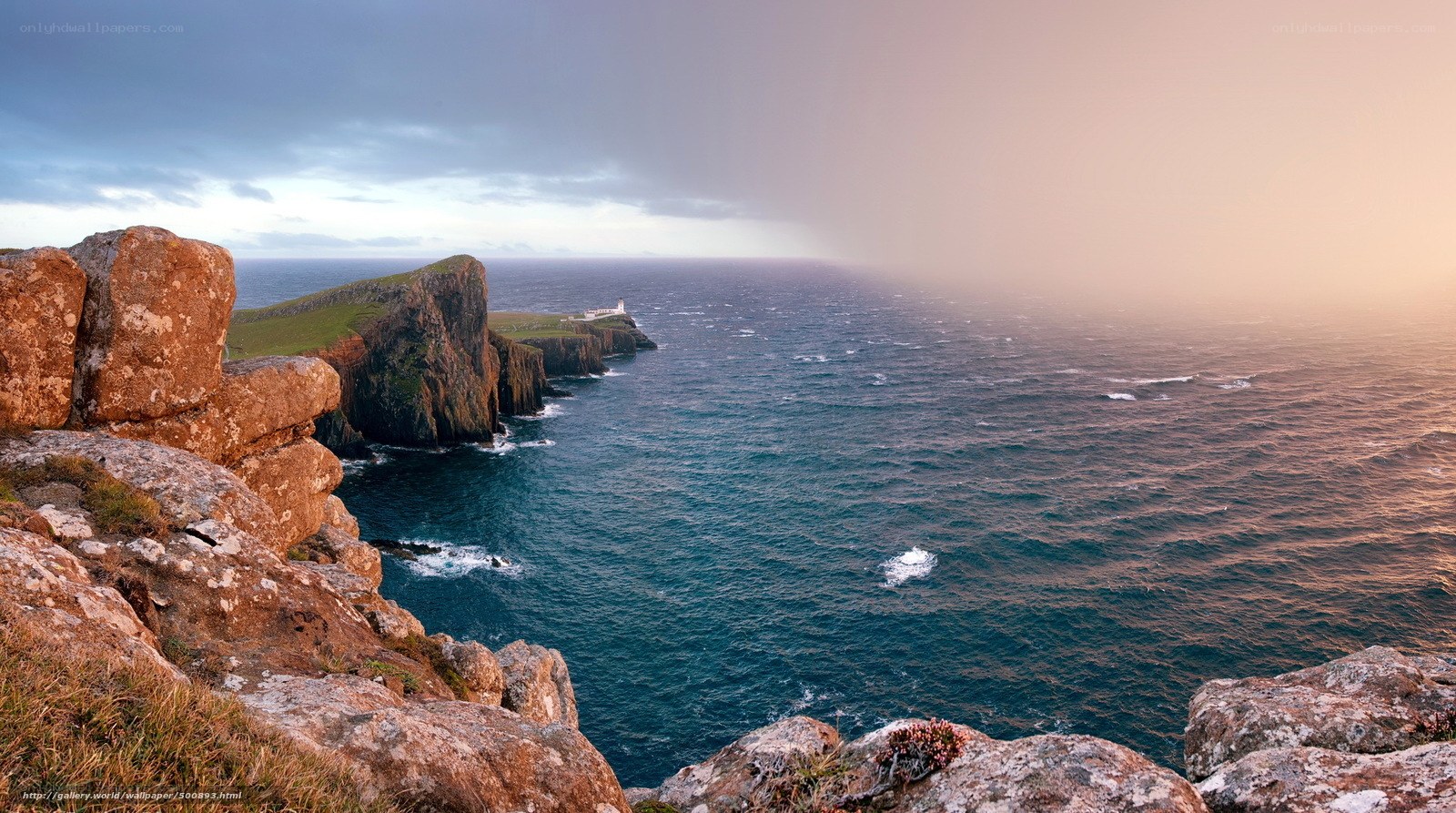 Cliffs and lighthouse at sunset