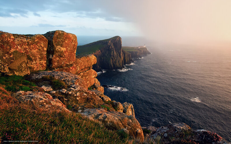 Cliffs and lighthouse at sunset