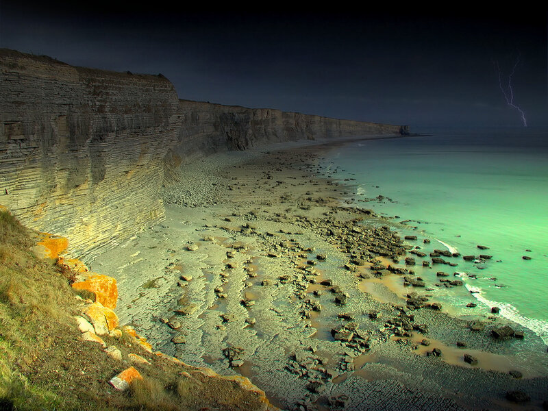 Cliffs and lightning at night