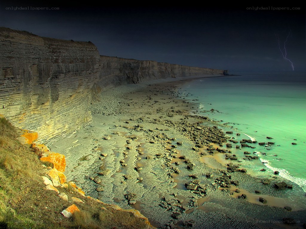 Cliffs and lightning at night