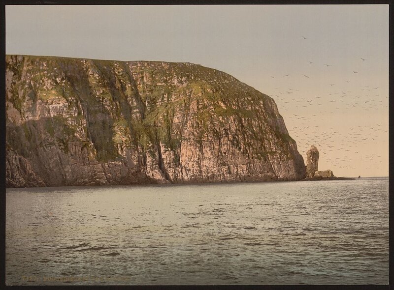 Cliffs and sea stack at dusk