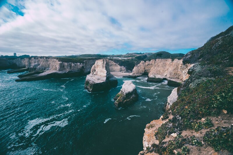 Cliffs and Sea Stacks — Blue, Dramatic, Afternoon, Photograph, Ocean, Sky, Vegetation