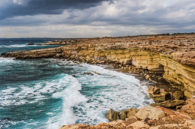 Cliffs and waves at coastal edge