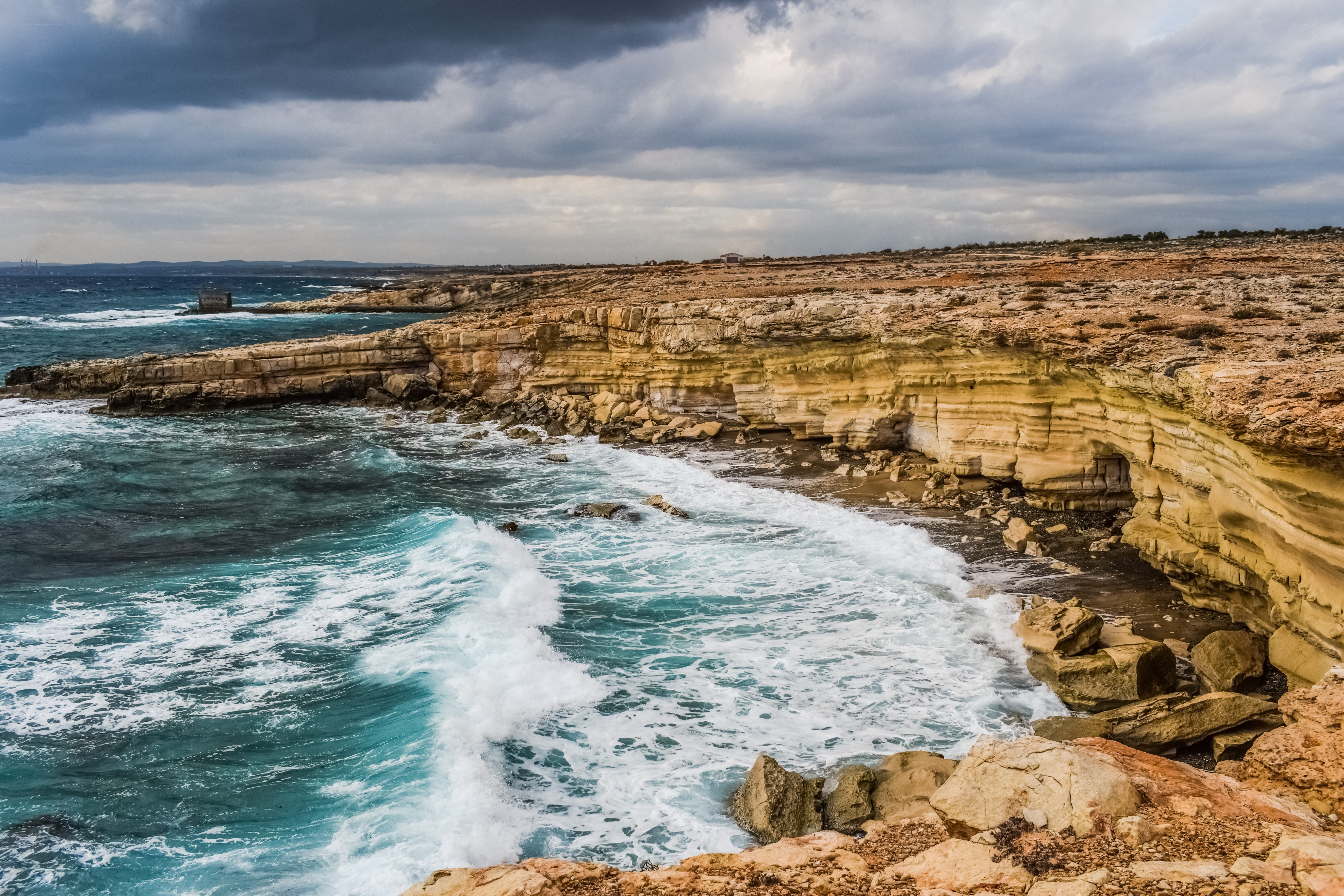 Cliffs and waves at coastal edge