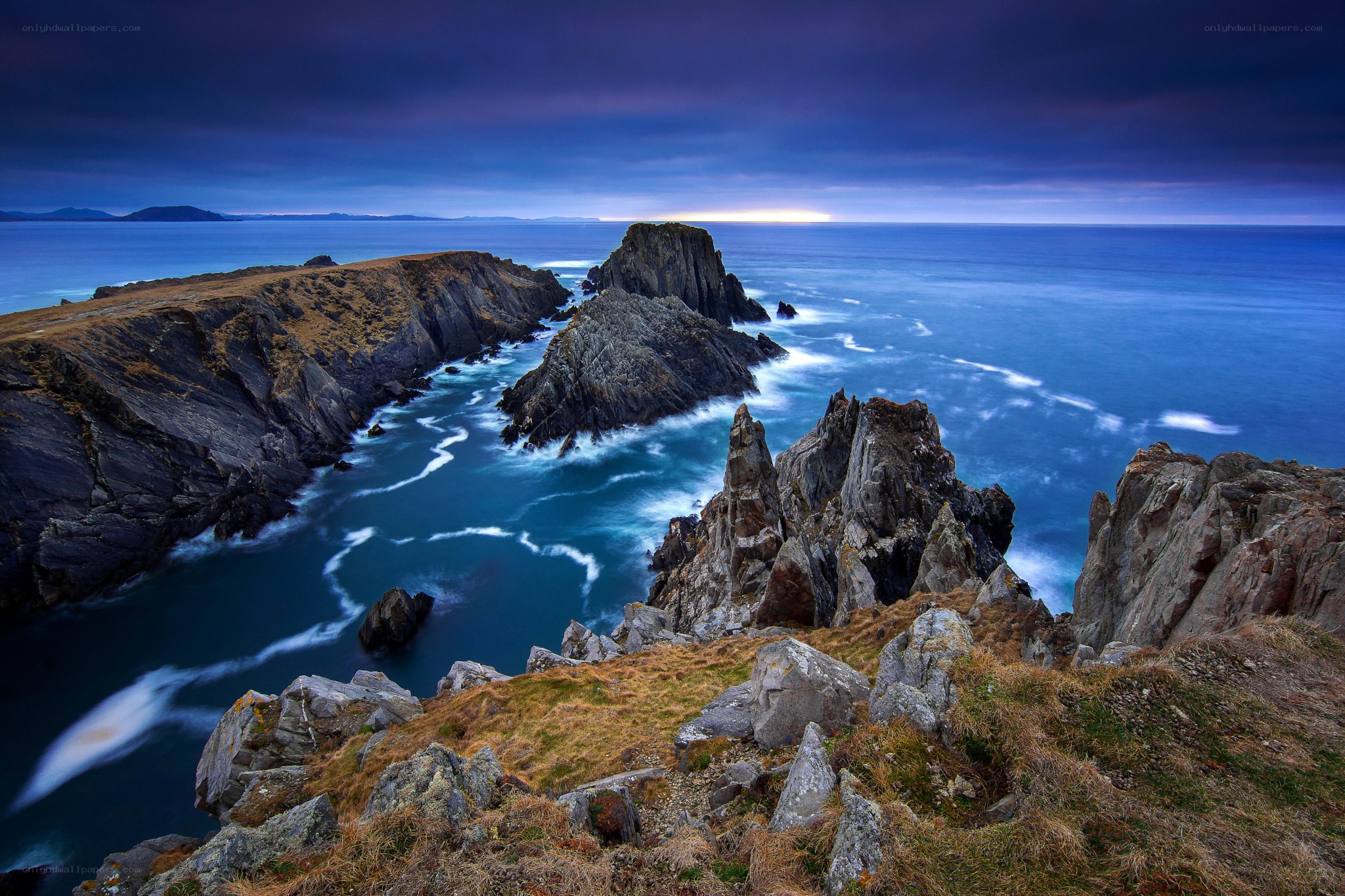 Cliffs at dusk by the sea