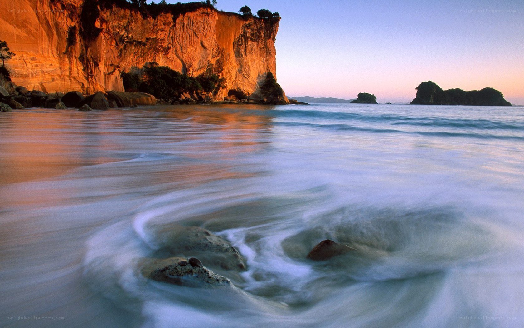 Cliffs at sunset by the sea